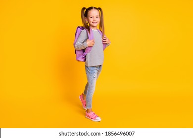 Full Size Photo Of Young Smiling Happy Schoolgirl Child Kid Wear Backpack Isolated On Yellow Color Background