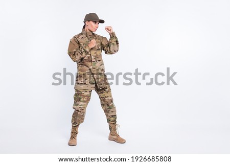 Full size portrait of strict young lady fists up look concentrated empty space isolated on white color background