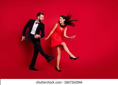 Full Size Profile Photo Of Funky Couple Dance Wear Vivid Dress Black Suit Isolated On Red Color Background