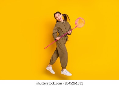 Full size profile photo of glad, carefree girl look camera beaming smile isolated on yellow color background