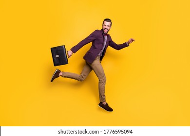 Full size profile photo of handsome stylish business guy jump high up rushing work office hold briefcase wear plaid shirt blazer trousers shoes isolated yellow color background