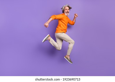 Full Size Profile Side Photo Of Mature Man Happy Positive Smile Go Walk Run Jump Hurry Sale Isolated Over Purple Color Background