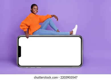 Full Size Profile Side Photo Of Young Pretty Cheerful Girl Sit Podium Isolated Over Violet Color Background