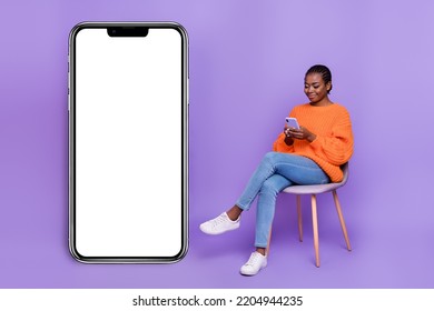 Full size profile side photo of young girl use mobile repost button download sit chair isolated over purple color background