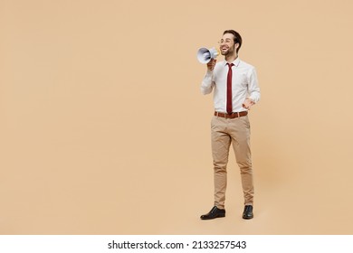 Full Size Young Employee Business Man Corporate Lawyer 20s Wear White Shirt Red Tie Glasses Work In Office Hold Scream In Megaphone Announces Discounts Sale Hurry Up Isolated On Plain Beige Background