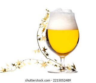 Full Snifter Glass Of Lager Of Pilsner Beer With Christmas Tinsel Isolated On White Background