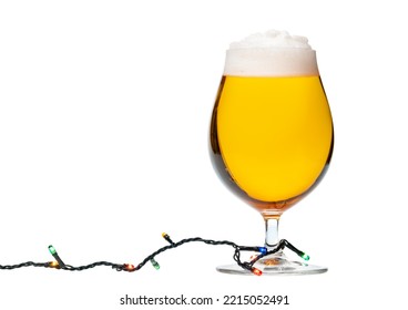 Full Snifter Glass Of Lager Of Pilsner Beer With Christmas Lights Isolated On White Background