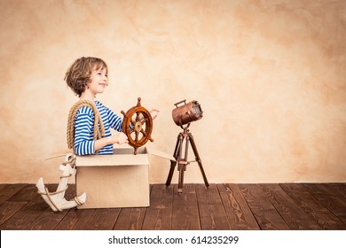 Full speed ahead! Child pretend to be sailor. Kid having fun at home. Summer vacation and travel concept - Shutterstock ID 614235299