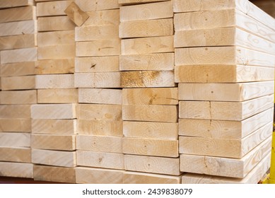 Full stack of 2 by 6 pine spruce woods framing studs building construction material on shelves at lumber yard of hardware home improvement store in Dallas, Texas, industrial background, builder. USA