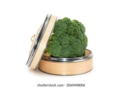 A Full Stem Of Broccoli In An Oriental Bamboo Vegetable Steamer Isolated On White