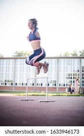 Full Of Strength And Will. Young Sports Woman Jumping.