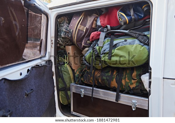 The full trunk of the car from things, bags,\
suitcases, backpacks. Transportation and transportation of goods on\
the trip
