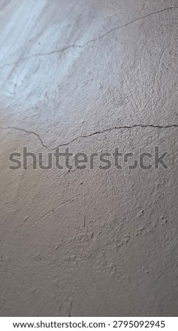 A full view of cracked and broken ceramic tiles with dark cement lines, creating an irregular abstract mosaic textured background.