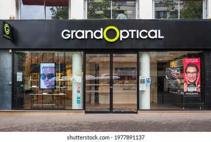 Full view of GRAND OPTICAL Store Shop front. French Style boutique of the brand GRAND OPTICAL with Store Signage and logo famous brand for eyewear and ophthalmology Glasses GRAND OPTICAL Store Shop