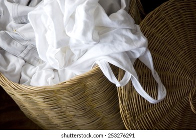 Full Of White Clothes In Basket Prepare For Laundry