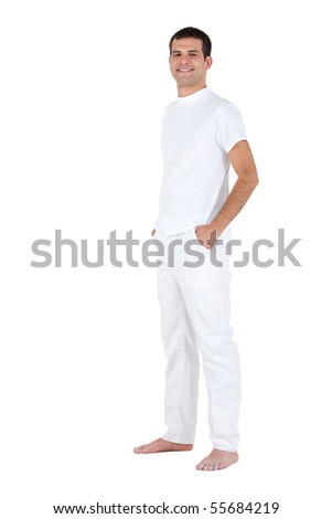 Man standing barefoot on a wooden walkway