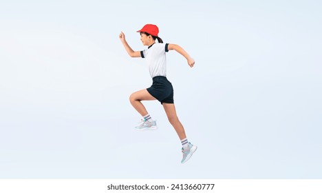 A full-body photo of an elementary school girl running wearing gym clothes. - Powered by Shutterstock