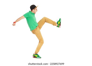 Fullbody portrait of young male kicking in studio isolated on white background. - Shutterstock ID 2258927699