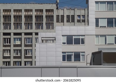 Full-color horizontal photo. The geometric landscape is made up of parts of the facades of residential and commercial buildings. - Powered by Shutterstock