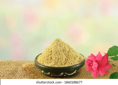 Fuller Earth Or Multani Mitti For Herbal Ayurvedic Face Pack With Rose Flower In Blur Background