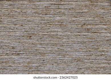 full-frame background and flat texture of stack of OSB compressed sawdust sheets. - Shutterstock ID 2362427025
