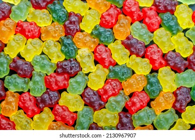 full-frame background and texture pattern of colorful jell bears laid closely on flat surface in high angle directly above view