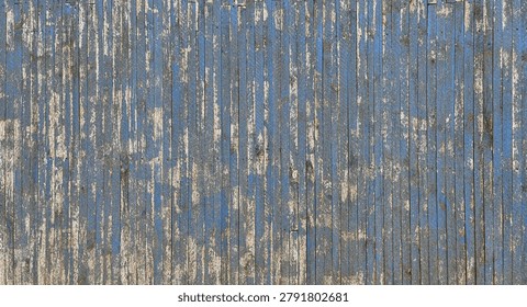 A full-frame horizontal shot of a rustic wall made from thin vertical wooden slats, featuring heavily weathered blue paint that is peeling and flaking away to reveal the natural beige timber underneath.