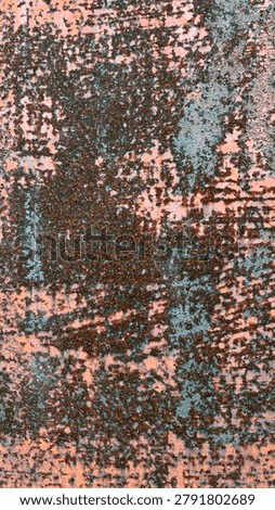 A full-frame vertical shot of a highly corroded and textured metal surface, featuring thick, bubbly brown rust patches overlapping peeling, faded orange and light blue paint.