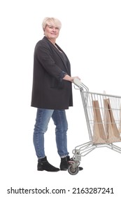 Full-length. Casual Mature Woman With Shopping Cart .