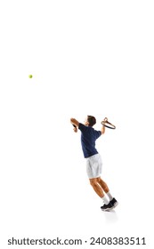 Full-length dynamic image of young man in his 30s, tennis plyer in motion, practicing, training isolated over white background. Concept of professional sport, competition, game, math, hobby, action