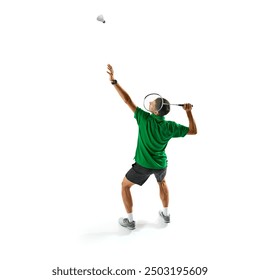 Full-length image of young men, badminton player serving shuttlecock with racket, practicing, preparing for game isolated on white background. Sport, competition, active and healthy lifestyle concept - Powered by Shutterstock