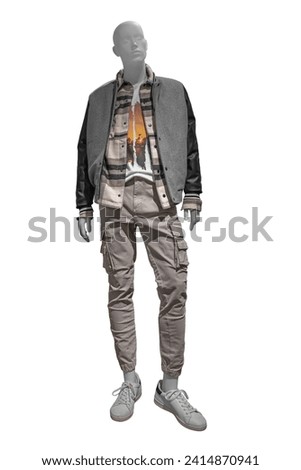 Full-length male mannequin dressed in stylish checkered shirt, grey jacket, beige trousers and white gumshoes isolated on white background with clipping path