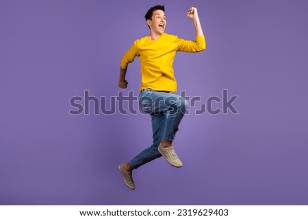 Full-length portrait of crazy excited handsome man jumping up runner fast sale isolated on shine background.