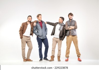 Full-length Portrait Of Group Of Young Men