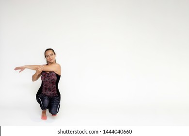 Full-length Portrait On White Background Of Beautiful Pretty Fitness Girl Woman In Trendy Tennis Sport Uniform, With Different Emotions In Different Poses, Shows Hands. Smiles. Stylish Trendy Youth.