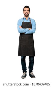 Full-length Shot Of Man With Apron Keeping The Arms Crossed In Frontal Position Over Isolated White Background