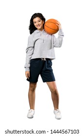 A Full-length Shot Of A Young Woman Playing Basketball Over Isolated White Background