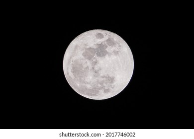 Fullmoon phase on July 25, 2021. Closeup of the super fullmoon in the summer Full moon Total Lunar in night dark shining bright texture isolated on black back