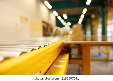 Fully automated logistics warehouse with a conveyor belt. Background is blurred. It is a modern storage - Shutterstock ID 2188597341