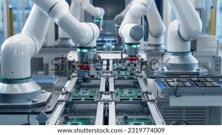 Fully Automated Modern PCB Assembly Line Equipped with Advanced High Precision Robot Arms at Bright Electronics Factory. Component Installation on Circuit Board. Electronic Devices Production Industry