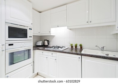 Fully Fitted White Kitchen With Stone Worktop