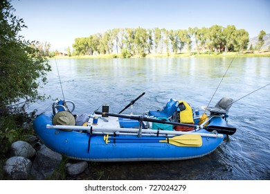 A Fully Loaded Fishing Raft Sits On The Side Of The Snake River In Utah. 