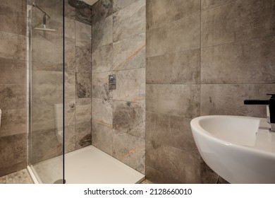 Fully Tiled Shower And Powder Room With Glass Shower Cubicle