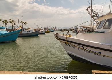 FULTON TX - MAR 28, 2016: Fishing Fleet And Pleasure Boats In Fulton Harbor On Texas Coast As Storm Clouds Gather.