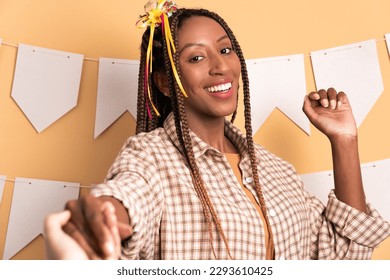 fun african american woman to Junina Party in Brazil in beige studio background. dancing - Shutterstock ID 2293610425
