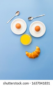 Fun Breakfast Concept With Abstract Happy Smiling Human Face Made Of Breakfast Items On Blue Background