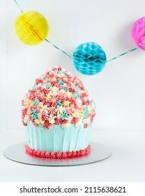 Fun Cake Giant Cupcake Por Celebration Birthday Party White Background With Copy Space. Selective Focus.