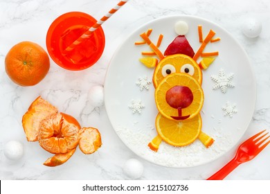 Fun Christmas Food Art Idea - Edible Reindeer From Orange Slices On White Plate, Healthy Fruit Snack For Kids 