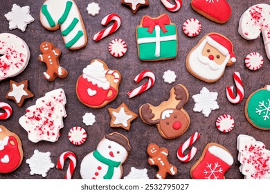 Fun colorful Christmas cookie background against dark stone. Top view. Holiday baking concept. - Powered by Shutterstock