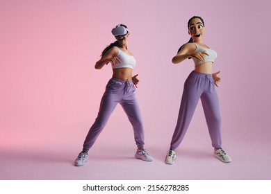 Fun dance moves in the metaverse. Happy young woman dancing as a 3D avatar in virtual reality. Cheerful young woman enjoying a simulation using virtual reality goggles.